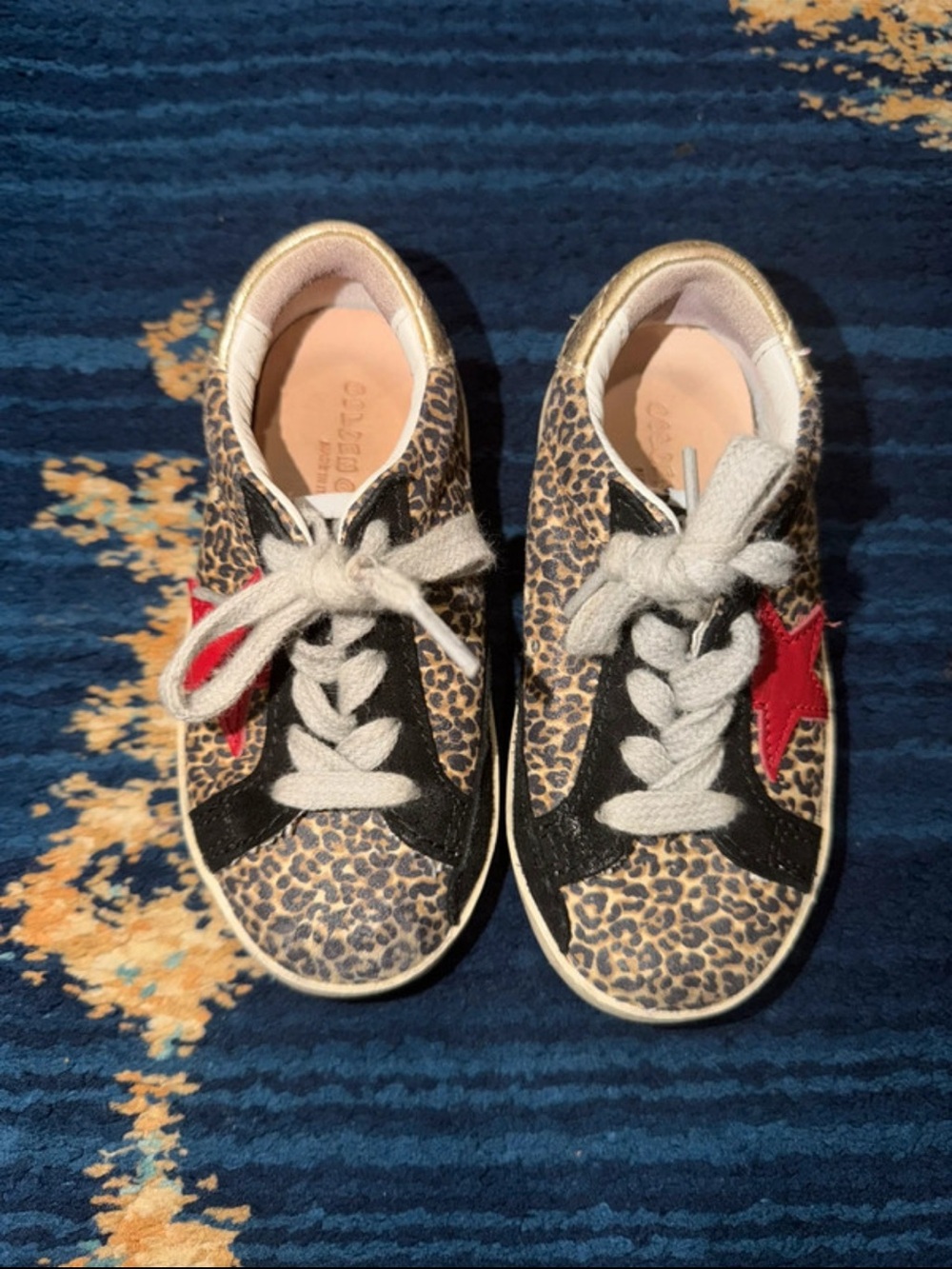 Golden Goose leopard print sneakers with red star